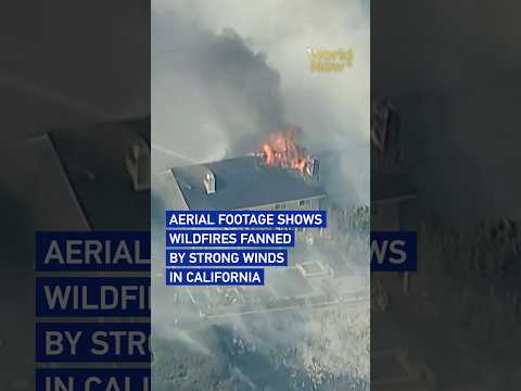 Aerial footage shows wildfires fanned by strong winds in California