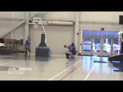 Joel Embiid works out from chair