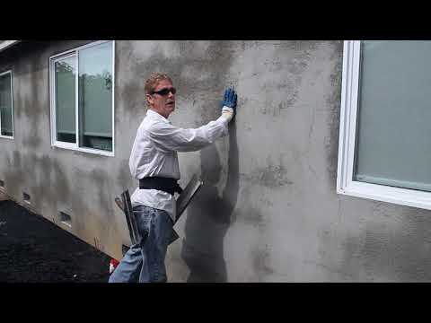 Stucco color finishing over base coats. Video