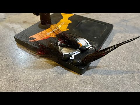 Tying marabou jigs for trout out of mini Australian Shepard dog hair.