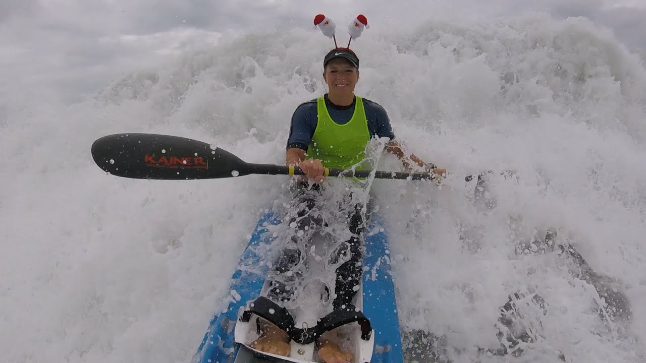 Catching a big wave on a double spec ski. Back paddler disappears