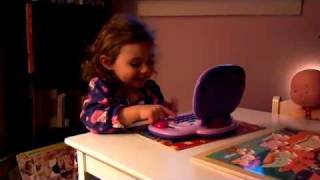 Elyse playing on her LeapFrog My Own Leaptop Viole