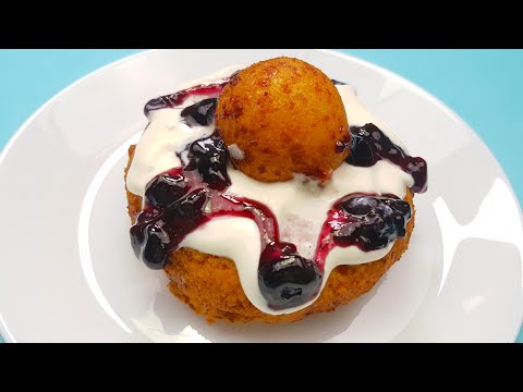 The fluffiest Romanian Papanasi (cheese donuts with sour cream and fruit preserve)
