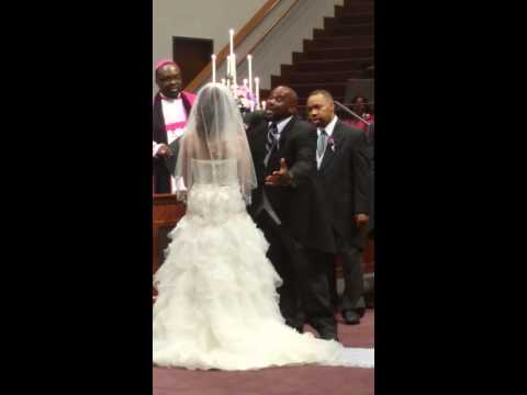 Bishop Grosjean L. Stephens sings to his bride, Debra Terry, on 7/27/14