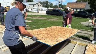 Assurant Global Auto helps with the build at Herrick Village