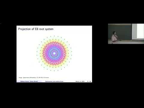 Sphere packing, energy minimization,  and modular forms by Abhinav Kumar