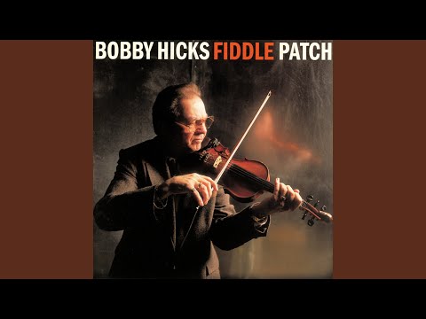 old guy in a hat playing a fiddle