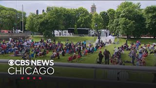 Crowd begins gathering for Obama Center opening ceremony watch party