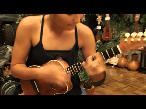 Hawaiian Player Azita Ganjali tries out a Shimo New Surf Tenor Ukulele @ Ukulele Mania, Tokyo