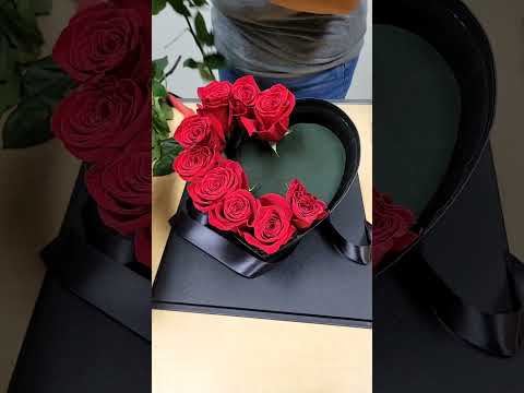 An Acrylic Pink Heart Box Flower Arrangement