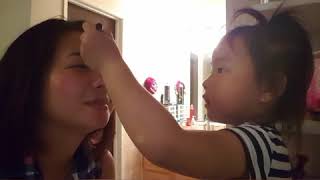 Little Sparkle Adonis is puttin makeup on her mommy!