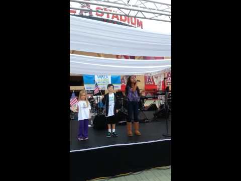 Analise Hoveyda singing National Anthem