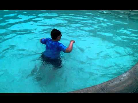 Lorenzo Lucchesi (accodion player) swimming in a pool in Lake Tahoe
