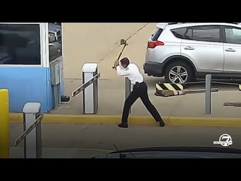 United pilot caught on video hacking away at parking gate with an axe at DIA