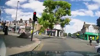 Falling tree narrowly misses pedestrians at London crossroads