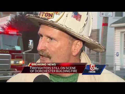 Firefighters battle massive fire at Dorchester building