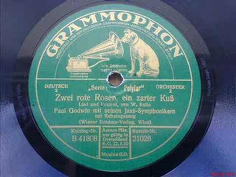 Zwei rote Rosen, ein zarter Kuss