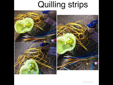 A threaded glass bottle decor with quilled coils and quilled leaves