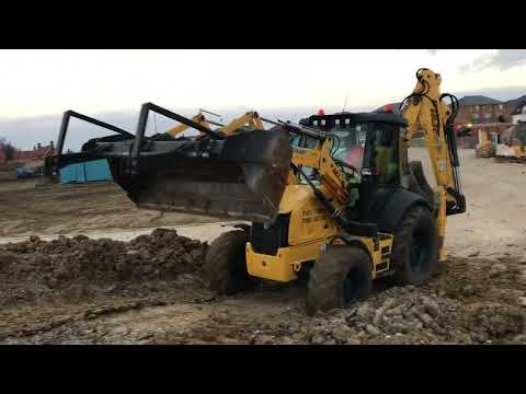 Обзор экскаватора погрузчика New Holland B110 с ковшом 40 см