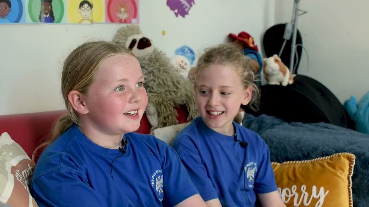 Two primary school students smiling