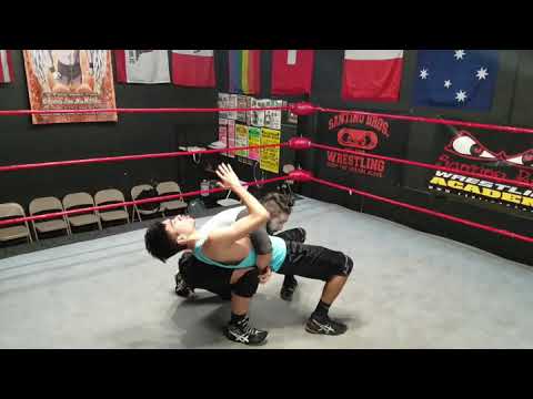 Back breaker / gut Buster combo