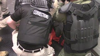 Video: MDC guards restrain inmate who died while in custody