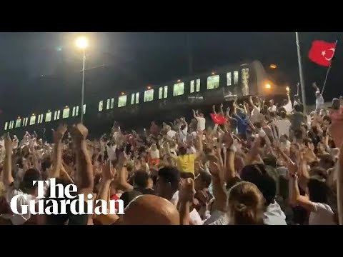 Train in Istanbul stops beside fan zone to watch Turkey v Austria