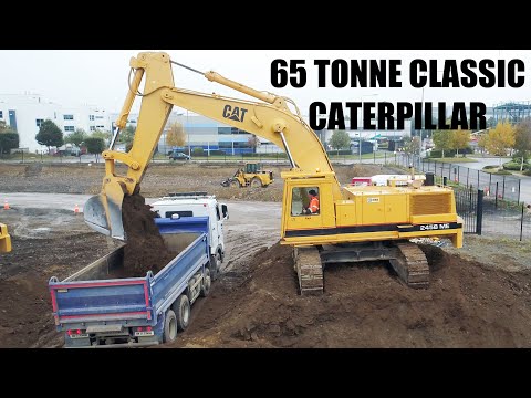 Cat 245B Loading Trucks