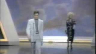 Dolly Parton sneaks up on Randy Travis