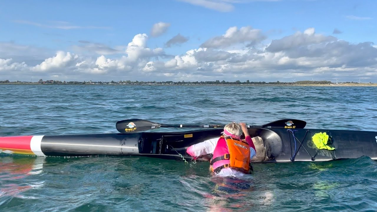 Surfski reentry in waves
