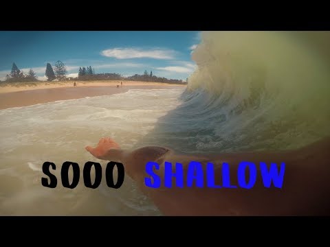 SHOREBREAK ON SAND