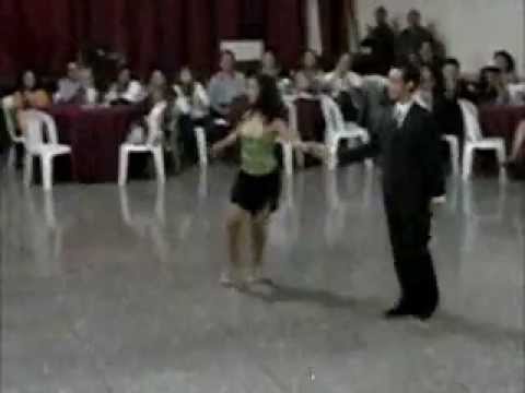  Angela Meléndez  and  Yumar Lugo  are  dancing  to  the  vals  "  Pabellon De Las Rosas  "