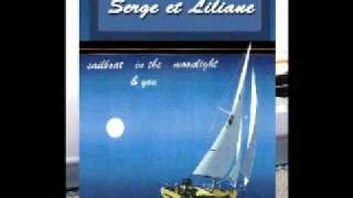 A sailboat in the moonlight