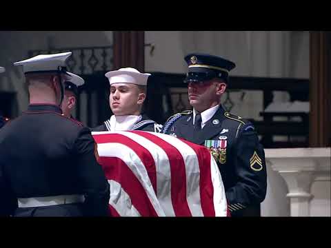 As a military band played, pallbearers carried the flag-draped casket of former President George H.W. Bush into Houston's St. Martin's Episcopal Church, where the Bush family regularly worshipped. (Dec. 5)