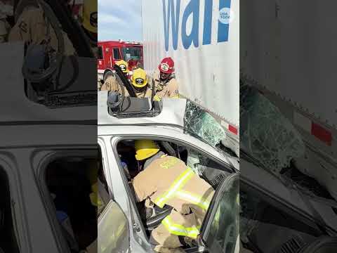 Driver trapped beneath tractor-trailer rescued by firefighters