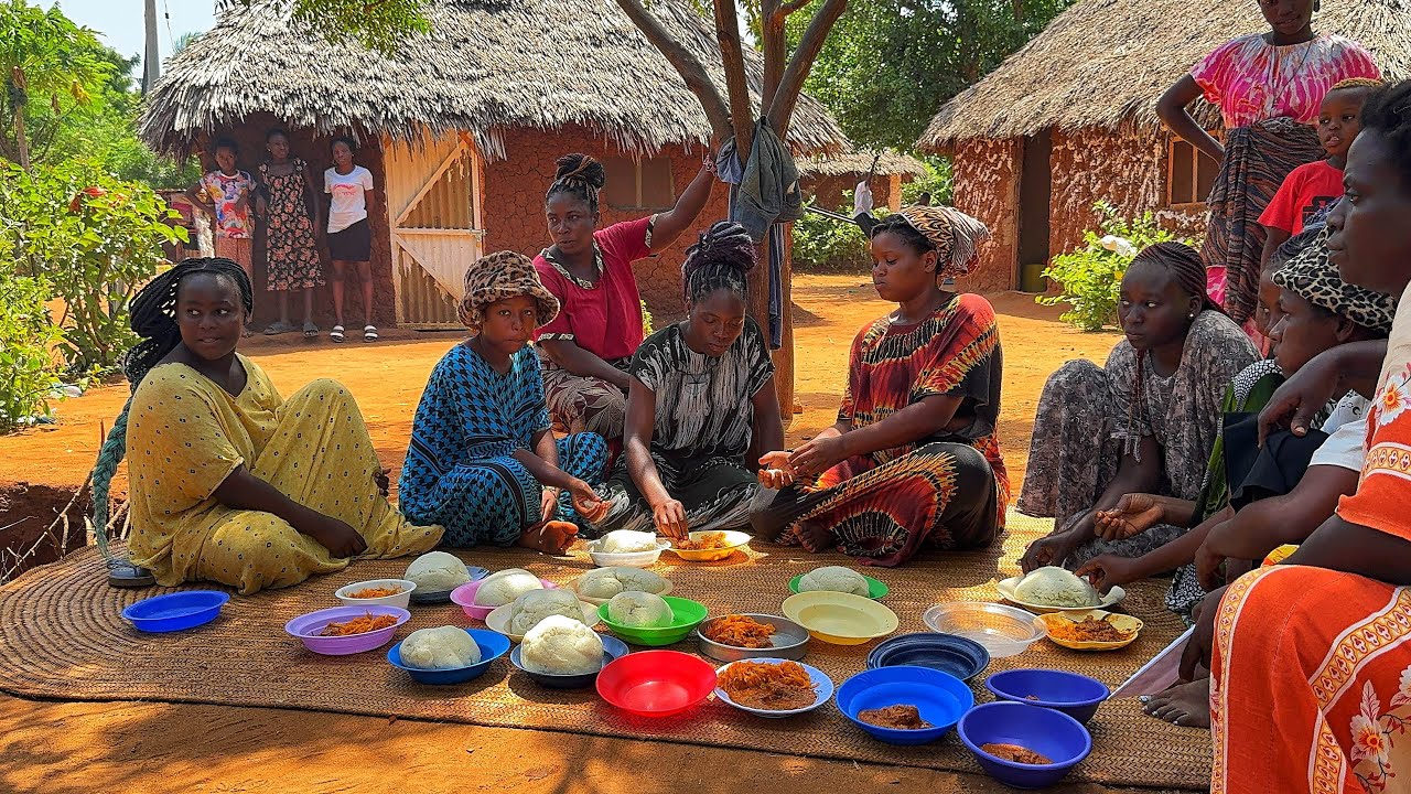African village life/Cooking African cuisine,Roasted lemon herbs beef stew with vegetables and ugali