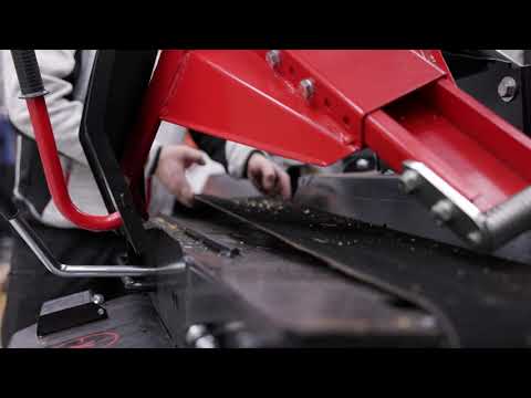 Belt adjustment of the Palax firewood processor's infeed conveyor