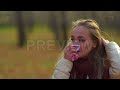 Woman Sneezing And Blowing Her Nose Into Handkerchief