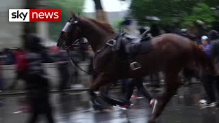 Officer knocked off horse during clash with BLM pr
