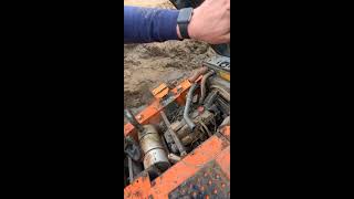 Recovery of Hitachi 130 from lagoon by J & R Millington