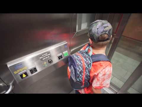 Sweden, Stockholm, Älvsjö railway station, 2X elevator - going to street level