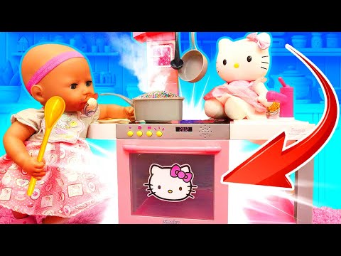 Baby Annabell doll pretends to cook toy food for a toy little kitten. Kitchen adventures!