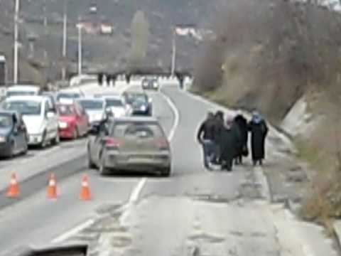 Border crossing between Kosovo and Macedonia. You can see people walking from one country to another