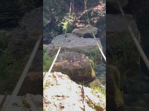 Hiking the Sentierelsa Trail Elsa Trail in Colle di Val d'Elsa, Italy - Crossing a Rope Bridge
