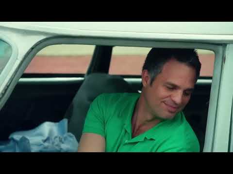 Trailer close-up: Cam and his daughters at the table, the score’s piano barely ahead of their laughter