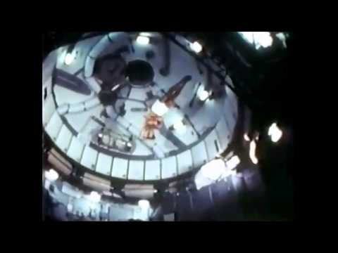 NASA astronauts performing gymnastics on board of the Skylab
