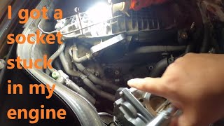 I got a 9/16" ratchet socket stuck in my engine while replacing spark plugs!  How I got it out.