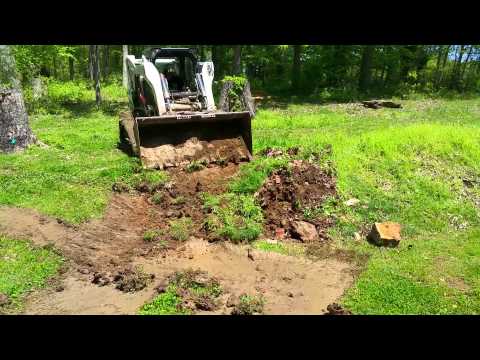 Bobcat digging RV pad