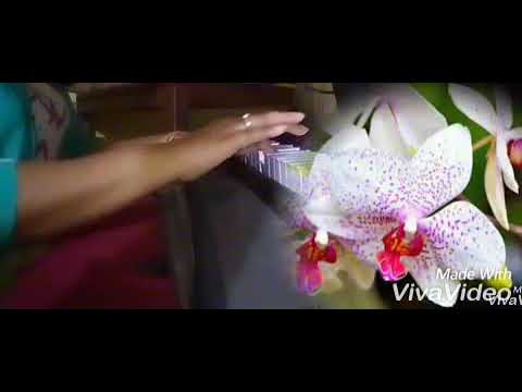 Dr Nivashri Deka  with an Orchid