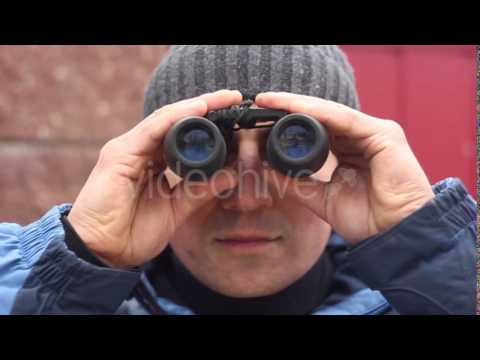 Man With Binoculars Looking Toward